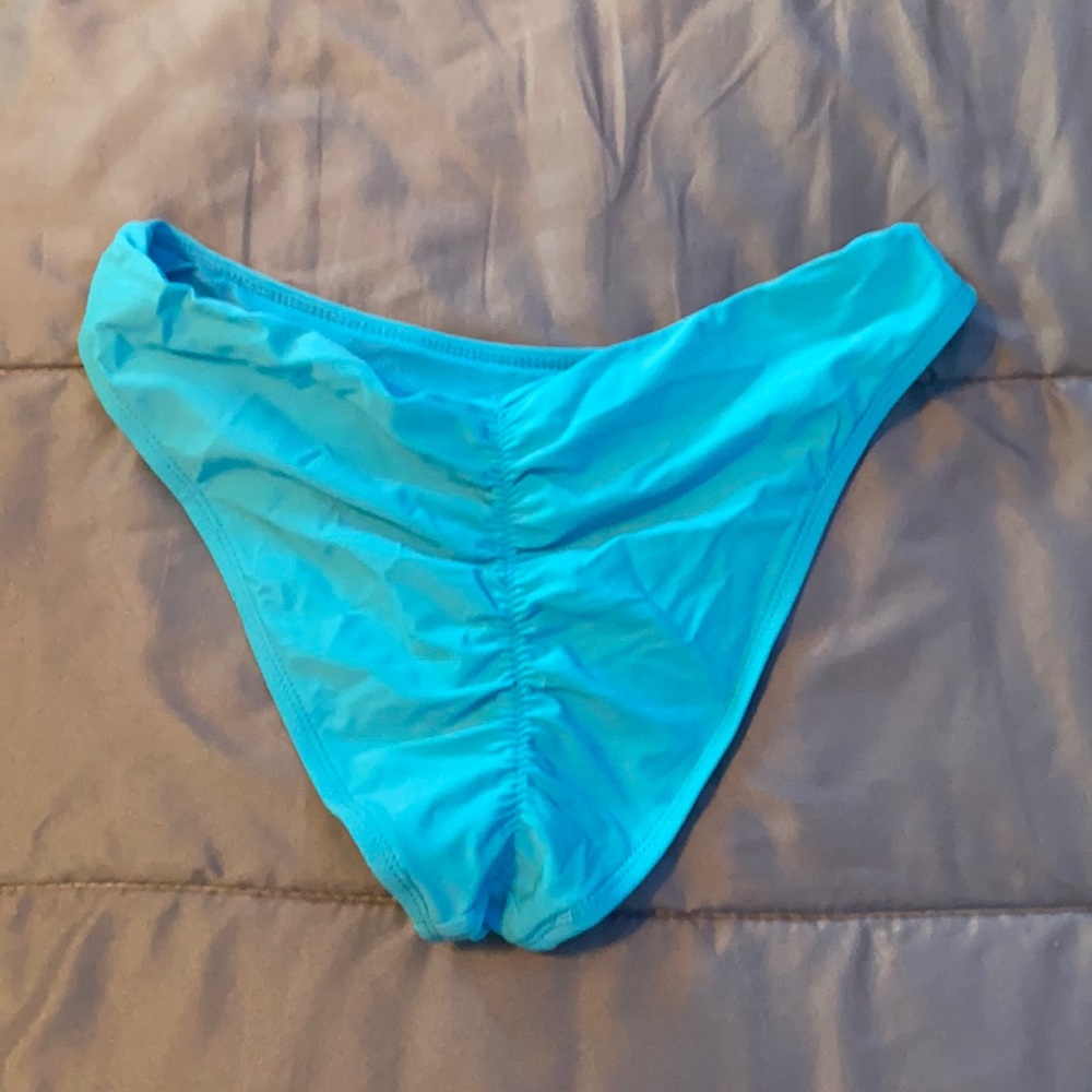 Blue scrunchie but small bathing suit bottoms